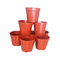 Rote runde Plastikblumen-Topf-Kindertagesstätten-Töpfe für im Garten arbeiten ein Topf